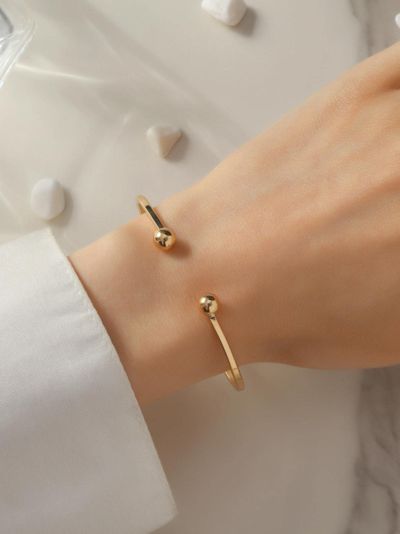 Goldfarbenes Manschettenarmband mit Kugeldekor für jeden Tag, schicke Eleganz